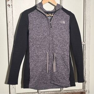 The North Face hooded full zip women’s sweater jacket with drawstring.